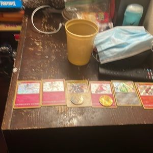 Shining Pokémon cards and 2 coins